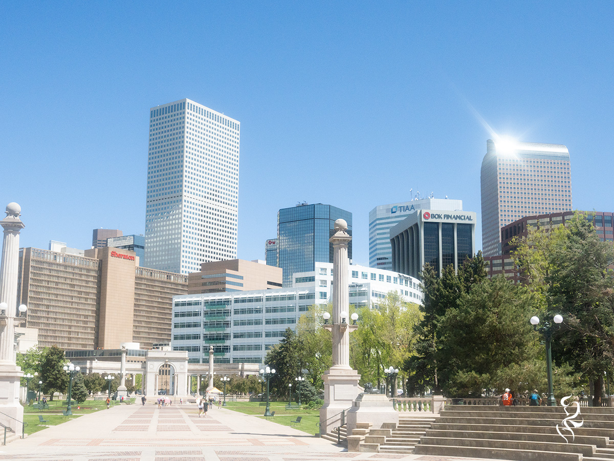 A sunny day in downtown Denver from Civic Center Park. In landscape dimensions