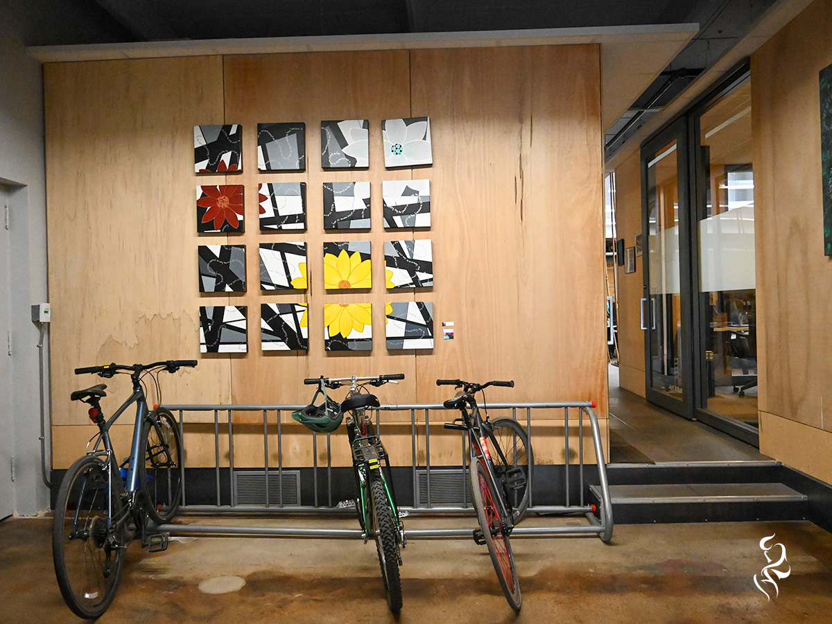 One of thinktank's favorite photos, taken at the Thrive Workplace: Ballpark location in Downtown Denver. It shows some beautifully staged art above a bike rack. Nothing quite says "Colorado" more than this photo, to me.