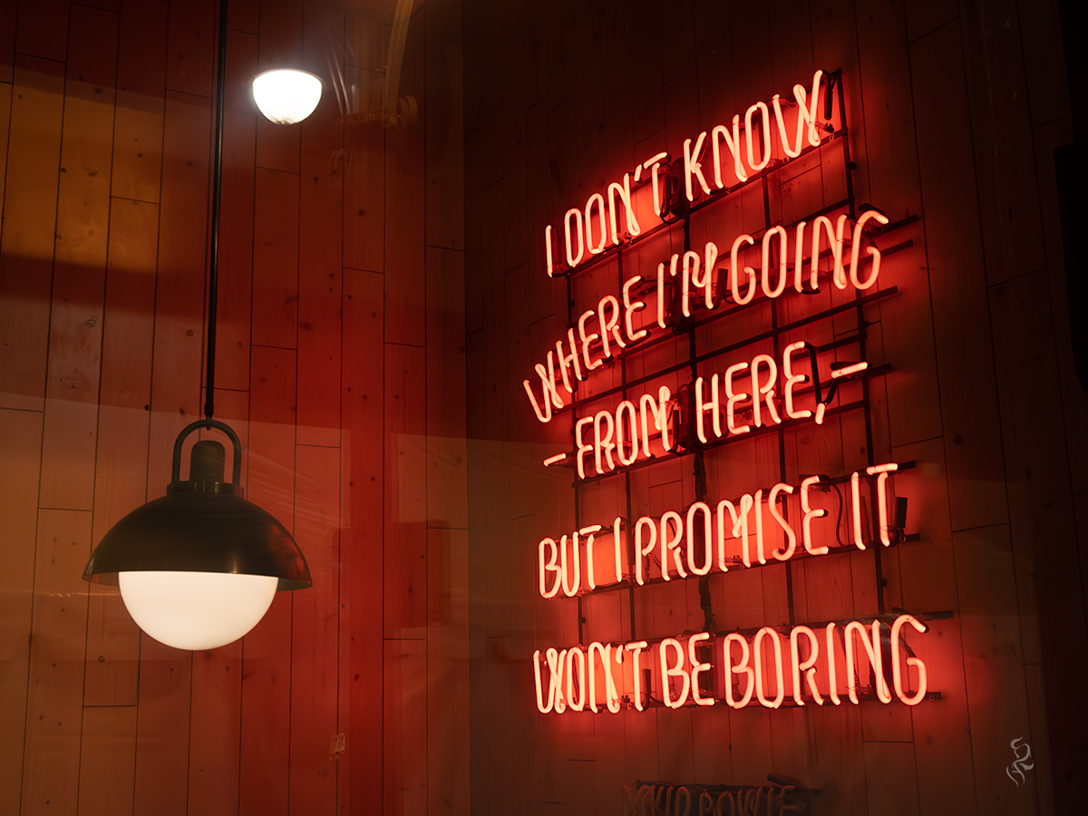 A picture of a neon sign that says, "I don't know where I'm going from here, but I promise it won't be boring" from a bar in Downtown Denver.
